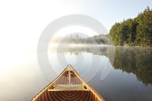 Canoeing on a Misty Lake