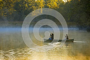 Canoeing through morning mist