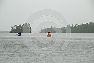 Canoeing into the rain photo