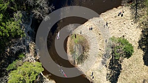 Canoeing, a type of rowing sport, follow of dual kayak going down the river.