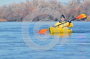 Canoeist on scenic river