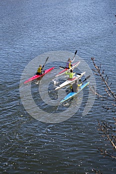 Canoeists paddling through the Tormes River in Salamanca, Spain
