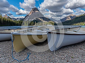 Canoes Along Shore of Two Medicine Lake photo