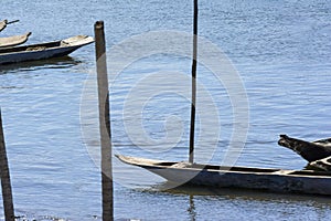 Canoes and boats docked on the bank of the grand Paraguacu river