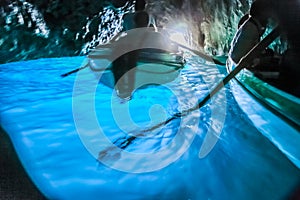 Canoes Inside turquoise grotto, Capri blue cave, Italy
