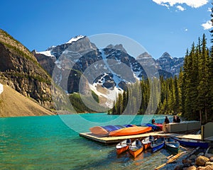 Canoes on a jetty at Moraine lake in Banff National Park, Canad