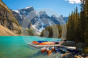 Canoes on a jetty at Moraine lake in Banff National Park, Canada