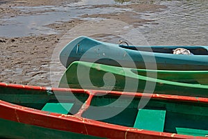 Canoes on the Riverside