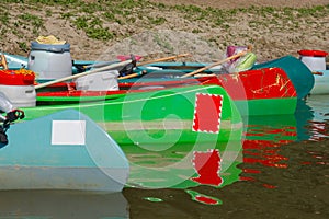 Canoes on the Riverside