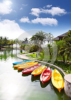 Canoes standby in resorts area, Brunei