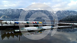 Canoes stored on winter lake