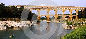 Canoing ancient roman aqueduct photo