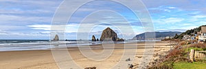 Canon beach rocks and surf panorama Oregon