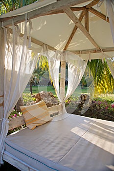 Canopy bed in tropical resort