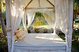 Canopy bed in tropical resort