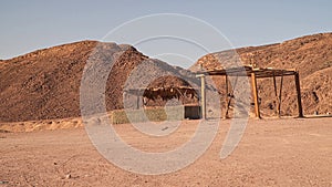 A canopy from the sun in a lifeless desert . Sinai