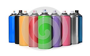 Cans of different spray paints on white background. Graffiti supplies