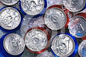 Cans of drink on crushed ice photo