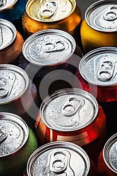 Cans of sweet drinks and beer. Cooling frozen