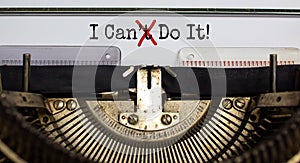 Cant crossed out to read I can do it concept for self belief, positive attitude and motivation written on an old typewriter photo