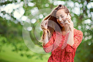 Cant help smiling when I hear your voice...a young woman talking on her cellphone outside.