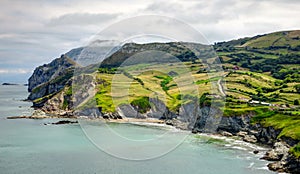 Cantabria landscape with hill, field and abrupt coast of the Atlantic Ocean