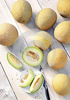 Cantalupe galia melons on a wooden table