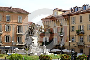 Cantarana Aqueduct Fountain. Fountain in piazza Medici in Asti represents a man under stress photo
