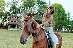 Canter on horseback. The allure of a young woman gently stroking a horse.Engage in horse therapy, nature weekends, and stress