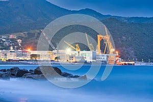 Large metal cranes in Riva Trigoso Shipyard during summer night photo