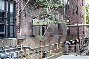 Cantilevered bottom section of urban housing fire escape photo
