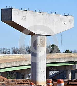 Cantilevered Bridge Support Awaits Steel in Highway Project photo