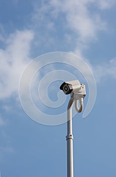 A cantilevered modern white security CCTV camera. photo