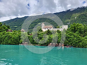 Scenic view of Iseltwald village on Lake Brienz shore.