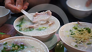 Cantonese congee boiled rice pork soup morning hot meal