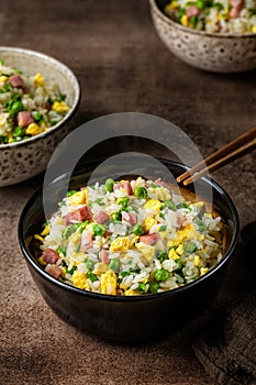 Cantonese Fried Rice with egg, green pea, ham steak spring onion, ribe long rice.