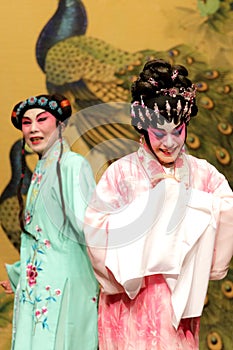 Cantonese Opera artists with colourful makeup and complicated costumes