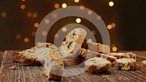 Cantucci cookies fall on a wooden surface