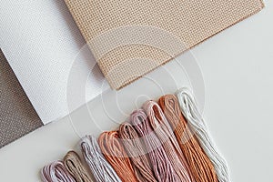 canva aida beige, gray and white and multi-colored floss thread, all for cross stitching