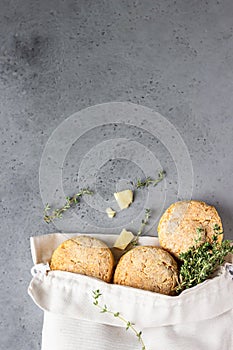 Canvas bag with homemade scone with cheese, thyme and pieces of cheese. Freshly baked delicious English scones.