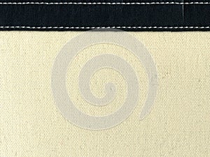 Canvas with leather strip and stitching photo