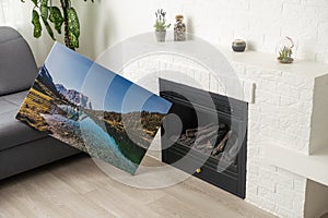 Canvas photo print on wooden floor. Sample of gallery wrapping method of canvas stretching on stretcher bar. Corner and
