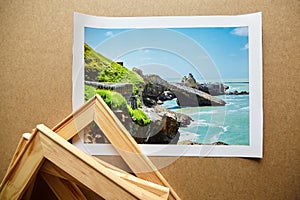 Canvas print and wooden stretcher bars on table. Landscape photography printed on canvas