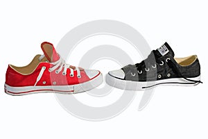 Canvas shoe balttle with white background, red and black shoe