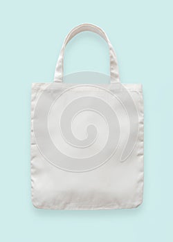 Canvas tote bag mockup blank white eco shopping sack template made of fabric cloth isolated on pastel blue background