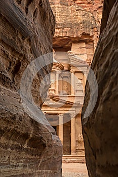 Canyon in the ancient city of Petra (Jordan) - opening view of the famous Al-Khazneh (aka Treasury) photo