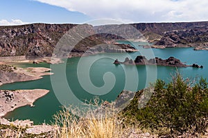 Canyon of the Atuel River. Huge lake surrounded by mountains photo