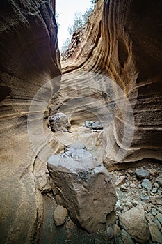 canyon eroded by water and wind on the Canary island of Gran Canaria called Barranco de las Vacas, with different colors and