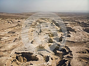 Canyon in the Judean Desert. Aerial view of the Judean desert located on the West Bank of the Jordan river. Deserted shore of dead