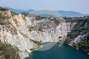 Canyon tourist famous cliff jumping spot with red cliff and blue water.